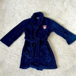 Boys Cherokee navy robe with red and silver crest. Size M